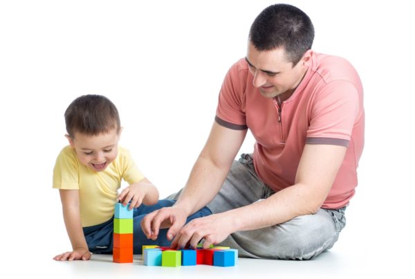 dad playing with child on autism spectrum