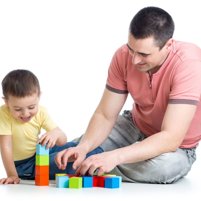 dad playing with child on autism spectrum