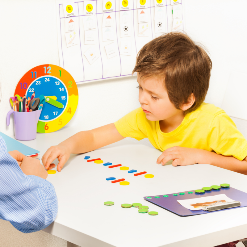 image of rbt certified therapist working with client with autism